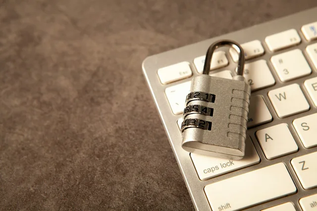 Padlock on a computer keyboard representing website account security