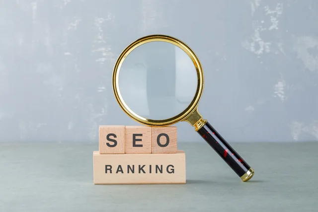 Magnifying glass and SEO letters representing search optimisation